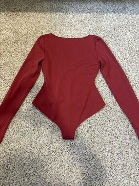 Athleta rust reddish colored Long-Sleeve Women's Bodysuit